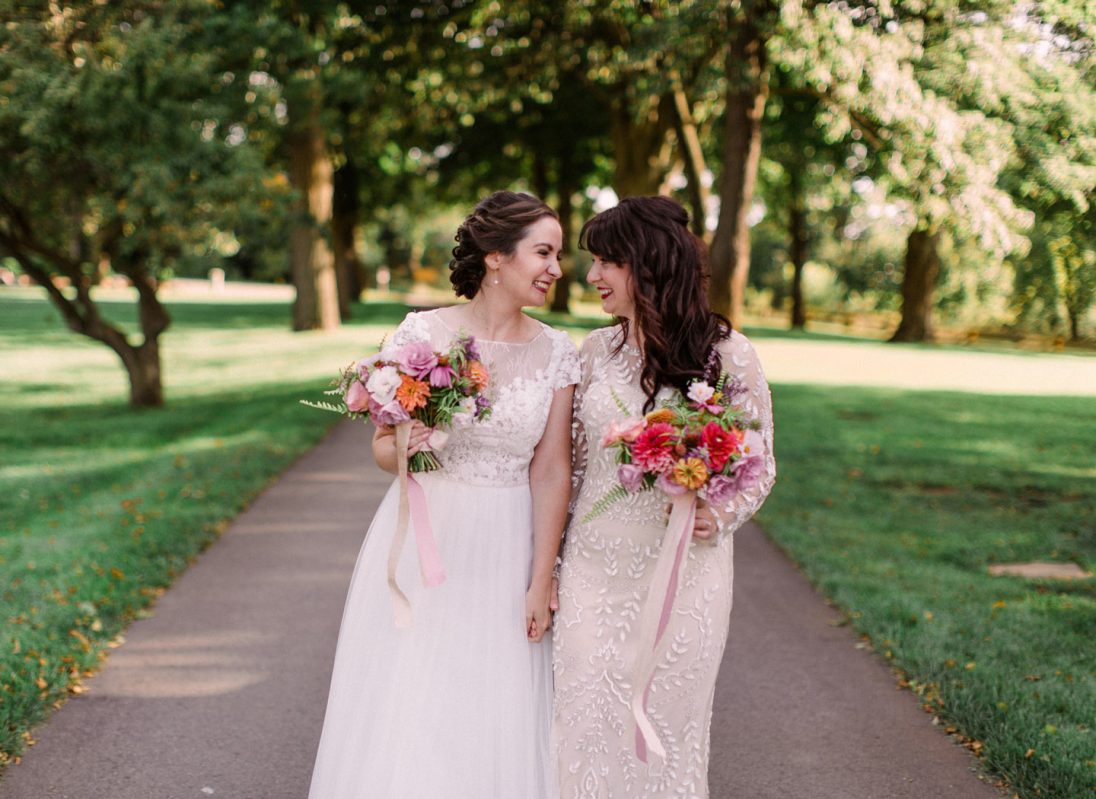 Two brides looking at each other