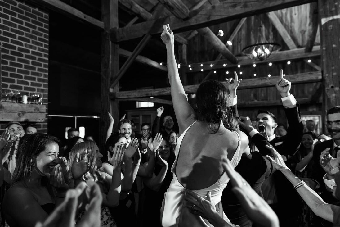 bride dancing at their wedding with other people around