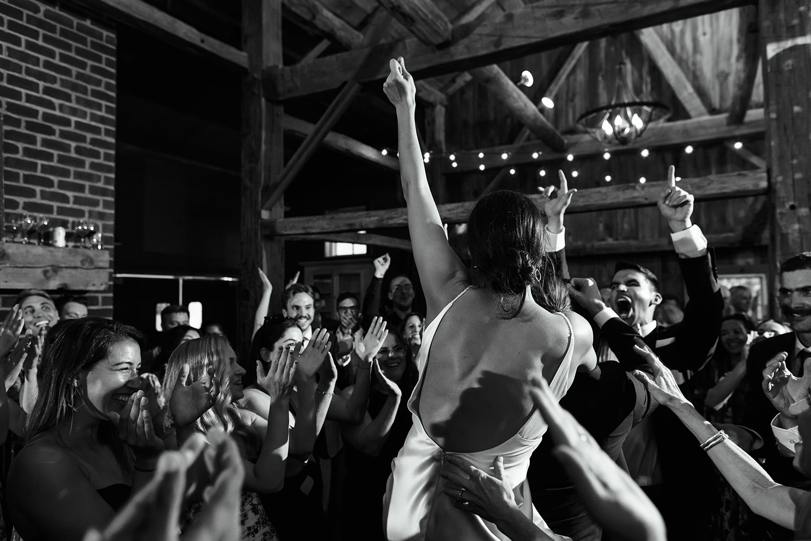 bride dancing at their wedding with other people around